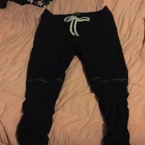 Black Moto pants with decorative zippers